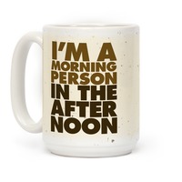 https://images.lookhuman.com/render/thumbnail/0498056005023002/mug15oz-whi-z1-t-i-m-a-morning-person-in-the-afternoon.jpg