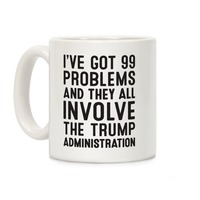 https://images.lookhuman.com/render/thumbnail/hIwQpajPUHE2azopMVJnG8JK1nVxkSeF/mug11oz-whi-z1-t-i-ve-got-99-problems-and-they-all-involve-the-trump-administration.jpg